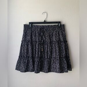 Indigo Rising black skirt with white flowers cute for summertime